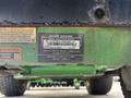 A 2021 John Deere 1575 lawn mower with a product identification label displaying model and serial numbers