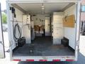 Interior of a 2008 Wells Industries Inc EW1422 trailer with metal walls and a rubber floor featuring storage compartments and various equipment mounted on the walls