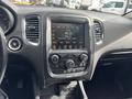Interior dashboard of a 2015 Dodge Durango featuring a touchscreen display and various controls for audio and climate settings