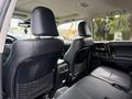 Interior view of a 2021 Toyota 4Runner showcasing the leather front seats and rear seat area with storage netting on the backs of the front seats