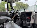 Interior of a 2012 International TerraStar showing the driver's seat steering wheel dashboard and gear shift