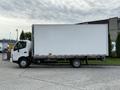 A white 2020 Hino 195 box truck with a Budget logo on the side and a large cargo area is parked with its driver's side facing the viewer