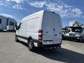 A white 2010 Mercedes-Benz Sprinter van showing its rear and side features with sleek design and wheels