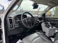 Interior of a 2016 RAM 5500 with a black steering wheel dashboard controls and a console with multiple levers and buttons