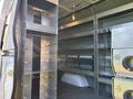 A 2024 Mercedes-Benz Sprinter 2500 with metal shelving and storage compartments installed in the cargo area