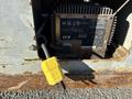 A close-up of a Skyjack SJ machine's control panel showing a 24V power supply with a yellow power cord plugged in