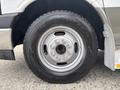 Close-up of a silver wheel with a Goodyear tire on a 2020 Chevrolet Express van
