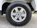 A 2021 Ford F-150 wheel with a silver alloy rim and rugged Toyo Tires all-terrain tire designed for off-road performance