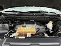 The engine compartment of a 2018 RAM 1500 showcasing the engine cover with hoses and fluid reservoirs visible
