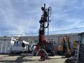 A 2018 Sandvik Ranger DX800, a hydraulic drilling rig, with a tall vertical structure and attached drilling arms, positioned in a work environment