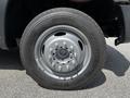 A close-up of a 2016 Ford F-550 wheel featuring a silver rim and a Continental tire with the size printed on the sidewall