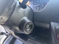 The steering wheel and ignition start button of a 2022 RAM Promaster 350