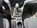 Interior view of a 2015 Ford Escape showing the gear shifter center console with buttons for park reverse neutral drive and a 12V power outlet