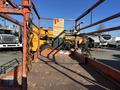 A 2010 Skyjack SJ aerial lift with a metal platform and safety chains visible in the foreground