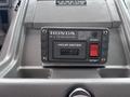 A Honda RV generator hour meter displayed on a dashboard showing a reading of 6.1 hours with a start and stop button