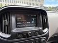 The image shows the interior dashboard of a 2017 Chevrolet Colorado featuring a touchscreen display with radio information and climate controls