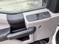 The interior door panel of a 2018 Ford F-550 with a control switch for windows and mirrors