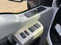 Close-up of the control panel of a 2015 Ford F-550 with window and lock buttons
