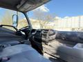 Interior view of a 2014 Hino 195 showing the dashboard steering wheel seats and gear shift with a focus on practical design features