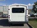 White 2017 Chevrolet Express seen from the rear with a large window and tail lights on either side