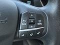 Steering wheel controls of a 2020 Ford Escape featuring buttons for navigation and audio functions
