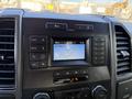 The image shows the dashboard of a 2018 Ford F-150 featuring a digital display radio and climate control buttons