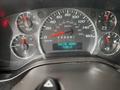 The dashboard of a 2018 Chevrolet Express showing speedometer fuel gauge and engine hours display reading 7102.5