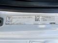 A white 2005 Freightliner M2 106 vehicle identification sticker displaying specifications and vehicle details