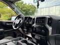 Interior view of a 2019 Chevrolet Silverado 1500 showcasing the dashboard steering wheel and center console with touchscreen display and controls