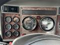 Dashboard of a 2008 Kenworth T370 featuring various gauges including speedometer tachometer and fuel level indicators
