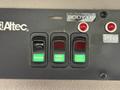 Control panel featuring three switches labeled Strobes, Work Light, and Spot Light with green indicators along with two red warning lights and a PTO switch