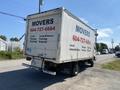A white 2014 Hino 195 moving truck with text that reads "MOVERS 604-727-6664 Local Storage Cleaning Disposal" on the side