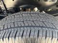 Close-up of a tire on a 2023 Ford F-350 SD showing tread pattern and detail