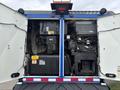 The image shows the rear view of a 2013 International DuraStar 4300 with the engine compartment doors open revealing the engine and various components inside