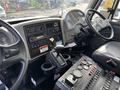 Interior cockpit of a 2012 International DuraStar 4300 showing the dashboard controls gear shifter and steering wheel