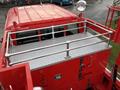 Top view of a red 2001 Toyota Dyna with a diamond plate deck and metal railings around the perimeter
