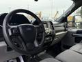 Interior view of a 2017 Ford F-450 Super Duty showcasing the steering wheel dashboard and front seating area