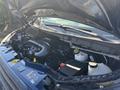 A 2016 Ford Transit 150 with its hood raised revealing the engine compartment and various components such as the battery coolant reservoir and air intake system