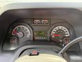 Dashboard of a 2019 Ford Econoline showing speedometer tachometer fuel gauge and odometer with indicators for engine temperature and warning lights