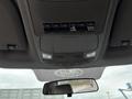 View of the interior ceiling console of a 2018 Ford F-550 featuring switches for auxiliary lights and two overhead lights