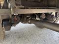 Undercarriage of a 2009 International 3000 CE showing the axle and suspension components with visible parts including air brake chambers and a drive shaft