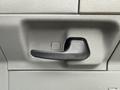 Interior door handle of a 2024 Ford E-450 designed for convenience and accessibility