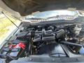 Engine compartment of a 2017 Ford F-250 SD showcasing the engine components and battery system