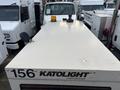 2005 Katolight SED60FPJ4 utility truck with a white top surface and a yellow flashing light on the cab