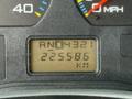 A digital dashboard display showing the gear position as RND4321 and an odometer reading of 225586 km