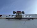 A rear view of a 2011 Autocar Xpeditor featuring two rectangular lights and a central mounted camera with a horizontal bar beneath