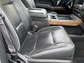 A black leather front seat of a 2017 Chevrolet Silverado 1500 with stitching details and a center console