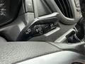 Close-up of the control stalk for headlights and windshield wipers in a 2017 Ford Transit vehicle interior