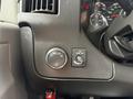 Interior dashboard controls of a 2020 Chevrolet Express featuring a circular dial for headlight settings and a switch for the dome light