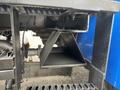 Close-up of a metallic triangular support structure on a 2013 International DuraStar 4300 with visible bolts and connections
